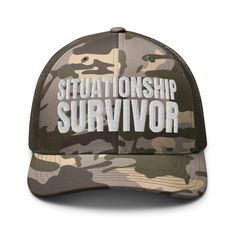 White embroidered olive camo trucker hat with 100% cotton front and mesh back. One size fits most. Camouflage Military Trucker Hat For Streetwear, Military Style Trucker Hat With Curved Brim, Military Style Khaki Snapback Trucker Hat, Military Style Khaki Trucker Hat Snapback, Military Style Khaki Trucker Hat, Military Camouflage Trucker Hat With Curved Bill, Military Style Camouflage Snapback Trucker Hat, Khaki Trucker Snapback Hat, Khaki Military Style Trucker Hat