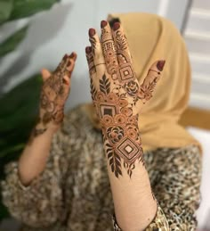 a woman with henna on her hands