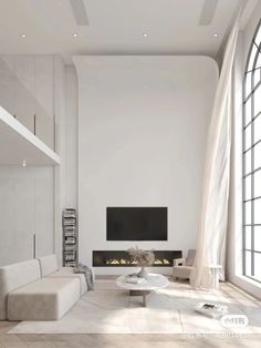 a living room with white furniture and large windows in front of the tv on the wall