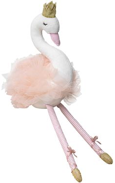 a stuffed flamingo wearing a pink tutu skirt and a gold crown on its head