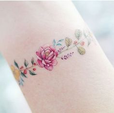 a woman's leg with a flower tattoo on it