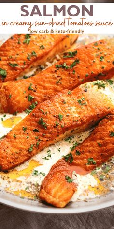 salmon fillets on a white plate with parsley