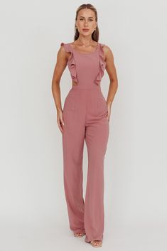 Jumpsuit Back cut-out Ruffle details Back button closure Invisible back zipper No lining Step into style with our chic Kiss Me jumpsuit. It features elegant ruffle straps that creates a graceful silhouette while the back cut-out adds a touch of allure. This jumpsuit effortlessly transitions from casual brunches to sophisticated soirées. Pair it with heels and your go-to jewelry to leave a lasting impression. MODEL INFO Model is wearing size XS Height: 5'7" Bust: 32" Waist: 23.6" Hips: 32.5" CARE Jumpsuit Pink, Ruffle Jumpsuit, Twitter Icon, Pink Jumpsuit, Iron Material, Kiss Me, Polyester Spandex, Best Sellers, Cut Out