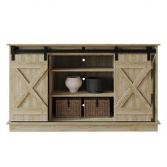 an entertainment center with sliding doors and baskets