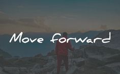 a man standing on top of a mountain with the words move forward in front of him