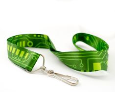 Be a gifting hero for your favorite technophile! I designed the imagery for this awesome lanyard based on the circuit boards I'm surrounded by. The lanyard is digitally printed from edge to edge on a smooth, synthetic fiber and is colorfast (won't bleed). The band is one inch wide and 35 inches (90cm) long. The end is outfitted with a swivel clip to hold your badge, ID, or keys. If you need more (office gifts?), please get in touch for corporate gift pricing. All items are shipped in a black cot Christmas Tech Gifts, Technology Classroom, Computer Circuit Board, Circuit Board Design, Pink Heart Necklace, Popular Earrings, Technology Gifts, Engineering Gifts, Sterling Silver Heart Necklace