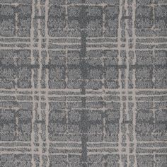 a gray and white rug with squares on it