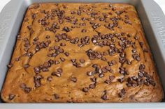 chocolate chip cookie dough in a baking pan ready to be baked into an icebox