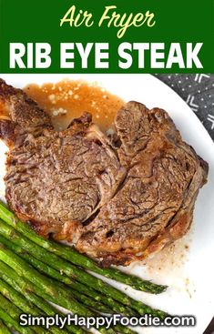 a plate with steak and asparagus on it that says air fryer rib eye steak