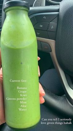 a person holding a green smoothie in their hand with the words, current five banana key greens milk