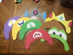 paper cut outs with angry birds on them sitting on a wooden table next to toys