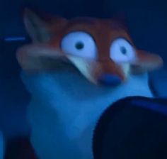 a blurry image of a fox with big eyes and an angry look on it's face