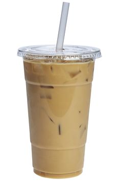 a plastic cup with a straw in it on a white background, filled with liquid