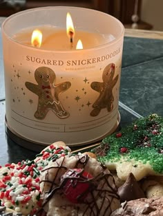 a candle and some cookies on a table