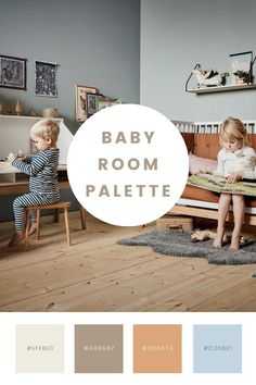 two children sitting on a bed in a room with wood flooring and wall colors