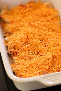 a casserole dish with cheese and meat in it