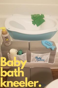 a baby bath kneeler sitting next to a sink