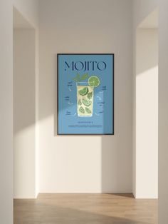 a poster hangs on the wall above a wooden floor in an empty room with white walls