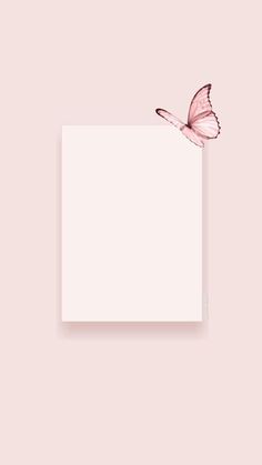 a pink butterfly sitting on top of a white sheet of paper with a blank space in the middle