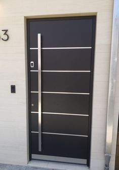 a black door with silver bars on it