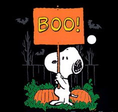 a cartoon snoopy holding a sign that says boo with pumpkins in the background