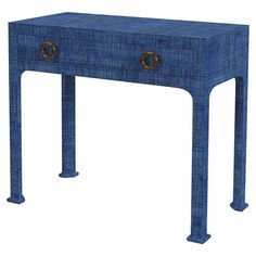 a blue console table with two brass handles