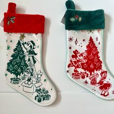 two christmas stockings are hanging on the wall