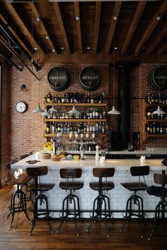 an instagramted photo of a bar with stools