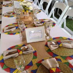 the table is set with place mats and place settings