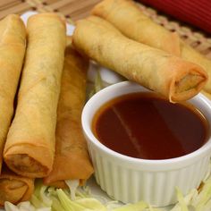 some food on a plate with dipping sauce