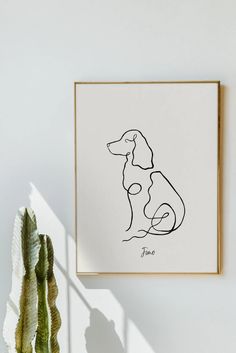 a drawing of a dog on a white wall next to a potted plant