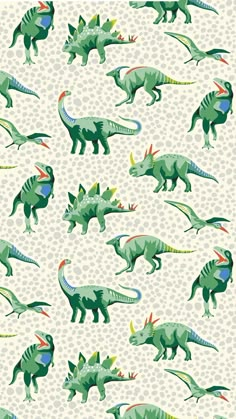 an image of dinosaurs in green and blue on a white background with polka dots