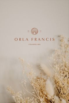 the logo for orla franois's commericing is displayed in front of some dry grass