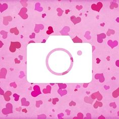 a camera with hearts all over it on a pink background that says, i love you