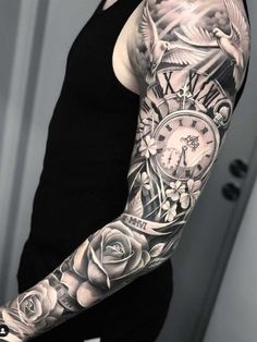 a man with a clock and roses tattoo on his arm