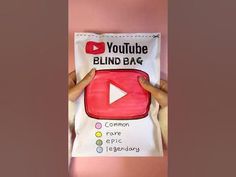 someone is holding up a bag with the word youtube and an image of a button on it