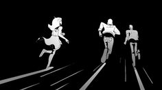 three people are walking in the dark with their backs turned to the same direction as they ride bicycles