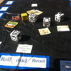 a table with dices and signs on it that read roll and read