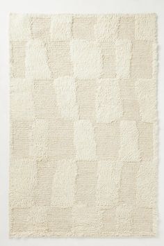 a white rug with squares on it