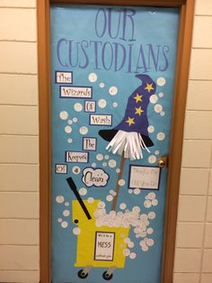 a door decorated with an image of a wizard's hat, broom and the words our customs