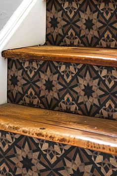 some brown and black tiles on the stairs