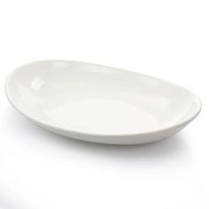 an empty white bowl sitting on top of a table