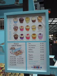 a sign showing prices for cupcakes and other treats