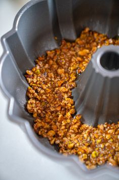 a cake pan filled with some kind of food on top of a white countertop