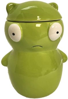 a green frog cookie jar with eyes and ears