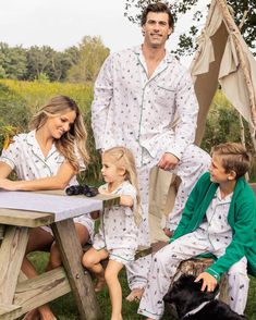 Wear your love of nature on your sleeve. Outdoor adventure meets cozy comfort with our new print featuring illustrations of classic camping scenes. Lush pine trees, pitch-perfect tents, glowing lanterns, and blazing bonfires against the backdrop of nature capture the essence of cherished family memories made around a campfire. This classic pajama set is accented with green piping and finished with pearl buttons. The sleepwear is made from the finest quality cotton and blended with just enough in Kids Pajama Party, Portland Christmas, Italian Royalty, Santa Sessions, Matching Family Holiday Pajamas, Family Christmas Pjs, Family Matching Christmas Pajamas, Christmas Family Pajamas, Christmas Pajamas Family