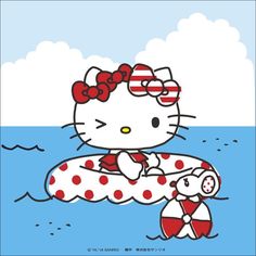 a hello kitty sitting on top of an inflatable raft with a teddy bear