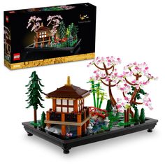 a lego set is shown in front of a box with flowers and trees on it