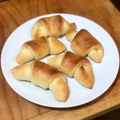 four pieces of bread on a white plate