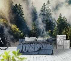 a bedroom with a mountain scene wallpaper and a bicycle parked in front of it